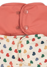 Load image into Gallery viewer, Konges Sløjd 2-pack dinner bibs with sleeves in frappe and canyon rose, waterproof fabric, and adjustable neck closures for kids.