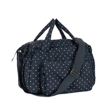 將圖片載入圖庫檢視器 A navy blue duffel bag with white polka dots, featuring dual top handles, a detachable shoulder strap, and multiple zippered compartments, shown on a plain white background.