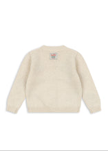 將圖片載入圖庫檢視器 A cream-colored knit sweater shown from the back, featuring a small colorful brand label on the upper back, set against a plain white background.