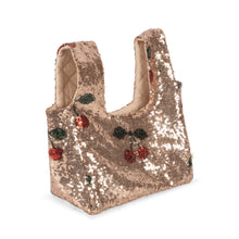 Load image into Gallery viewer, A small sequined tote bag in a warm metallic rose-gold tone, decorated with embroidered cherries and leaves, shown on a plain white background.