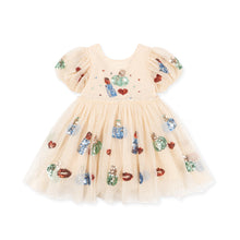 Load image into Gallery viewer, A baby girl's tulle dress in a light peach-beige color, decorated with colorful sequins and embroidered motifs of lipstick tubes, lips, and small hearts. It features short puff sleeves and a ruffled skirt, shown against a plain white background.