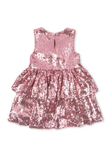 Load image into Gallery viewer, A sleeveless tiered dress covered in pink sequins, shown from the back on a plain white background.