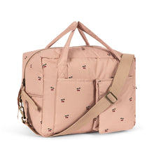 Load image into Gallery viewer, Pink travel bag with floral pattern on a white background