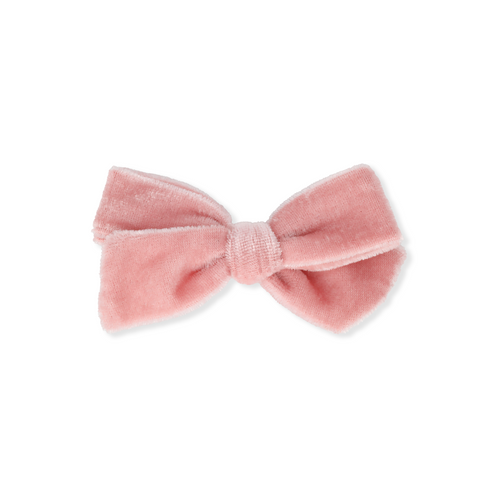 Pink velvet bow on a white background