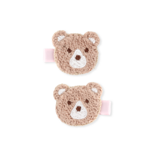 Two brown teddy bear-shaped hair clips on a white background