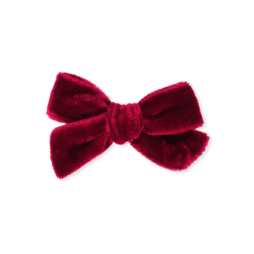 Red velvet bow on a white background