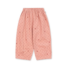 Load image into Gallery viewer, Pink pajama pants with a subtle pattern on a white background